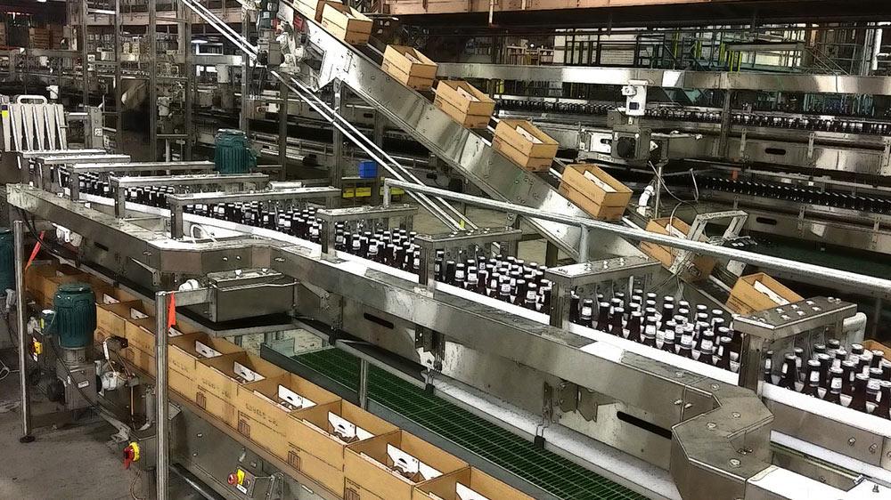 Bottles and boxes on packaging line.